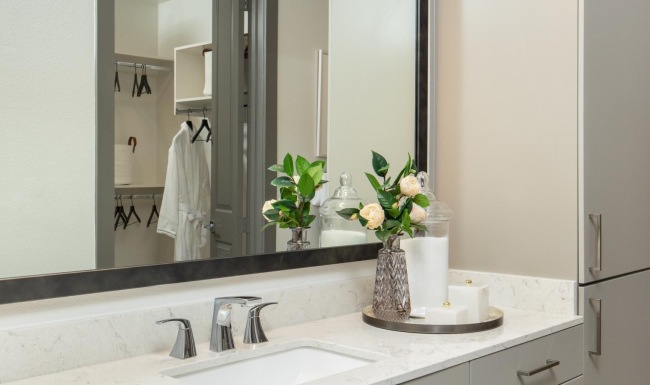 Bathroom options with thoughtful details a bathroom with a large mirror and sink