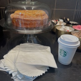 Happy Monday Residents! napkins a bundt cake and a cup of coffee