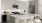 a kitchen with grey cabinets and stainless steel appliances