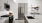 a kitchen with grey cabinets and stainless steel appliances