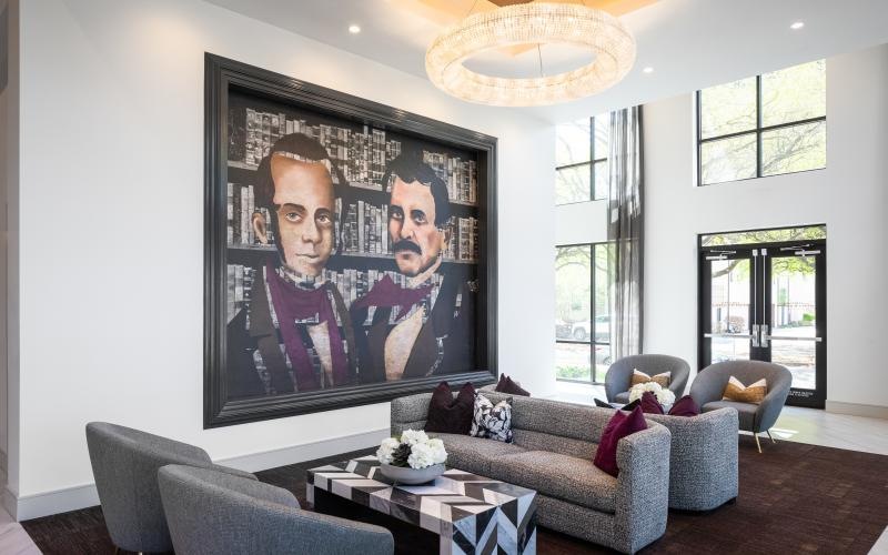 Find your perfect fit at Chelsea Museum District a seating area with a large piece of art on the wall