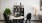 a table with chairs and a shelf glasses and accent pieces